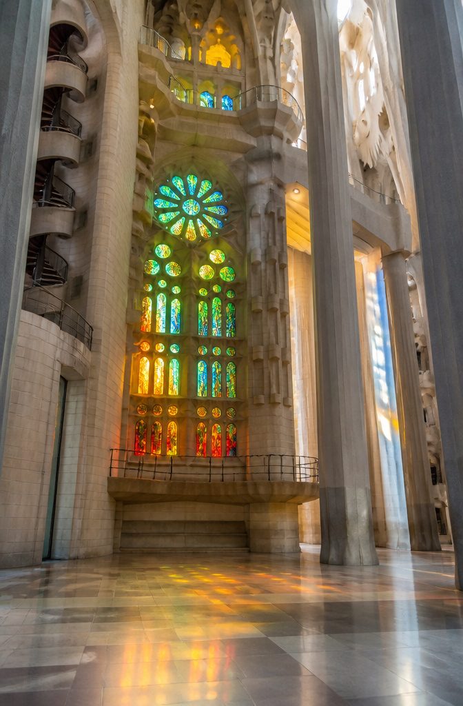 Beautiful Stained Glass Windows: 14 Sites That Changed Light Forever 2 Abstract stained glass windows in La Sagrada Familia capturing colorful light.