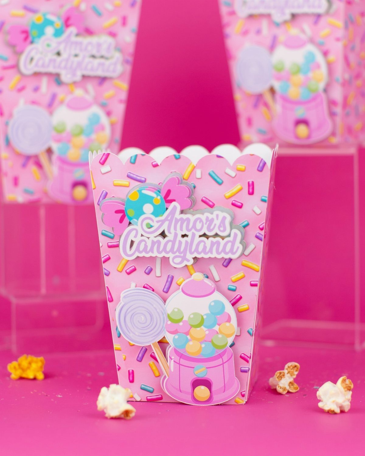 DIY Candyland Decorations: 10 Creative Party Ideas 10 Pink decorated treat boxes with candy illustrations and sprinkles on a bright pink background.