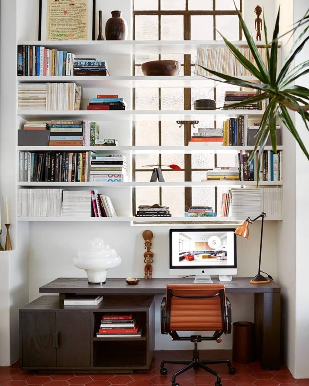 Front Window Design Ideas: 11 Looks Worth Stealing for 2026 2 White built-in bookshelves filled with books and decor positioned in front of a large window.