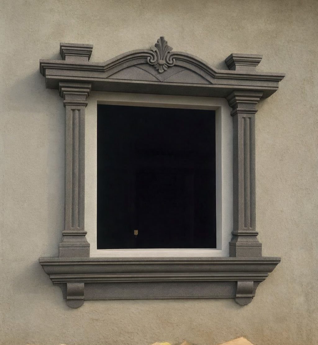 Front Window Design Ideas: 11 Looks Worth Stealing for 2026 10 An ornate rectangular window with decorative grey architectural molding and columns on a plain wall.