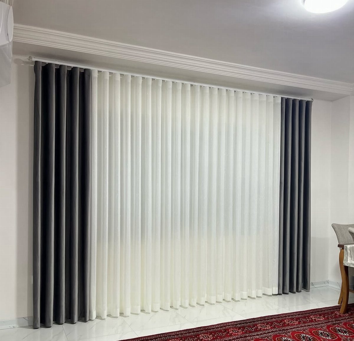 13 House Curtains Ideas for Every Style 13 White and dark grey floor-length curtains hanging on a white rod in a bright room.