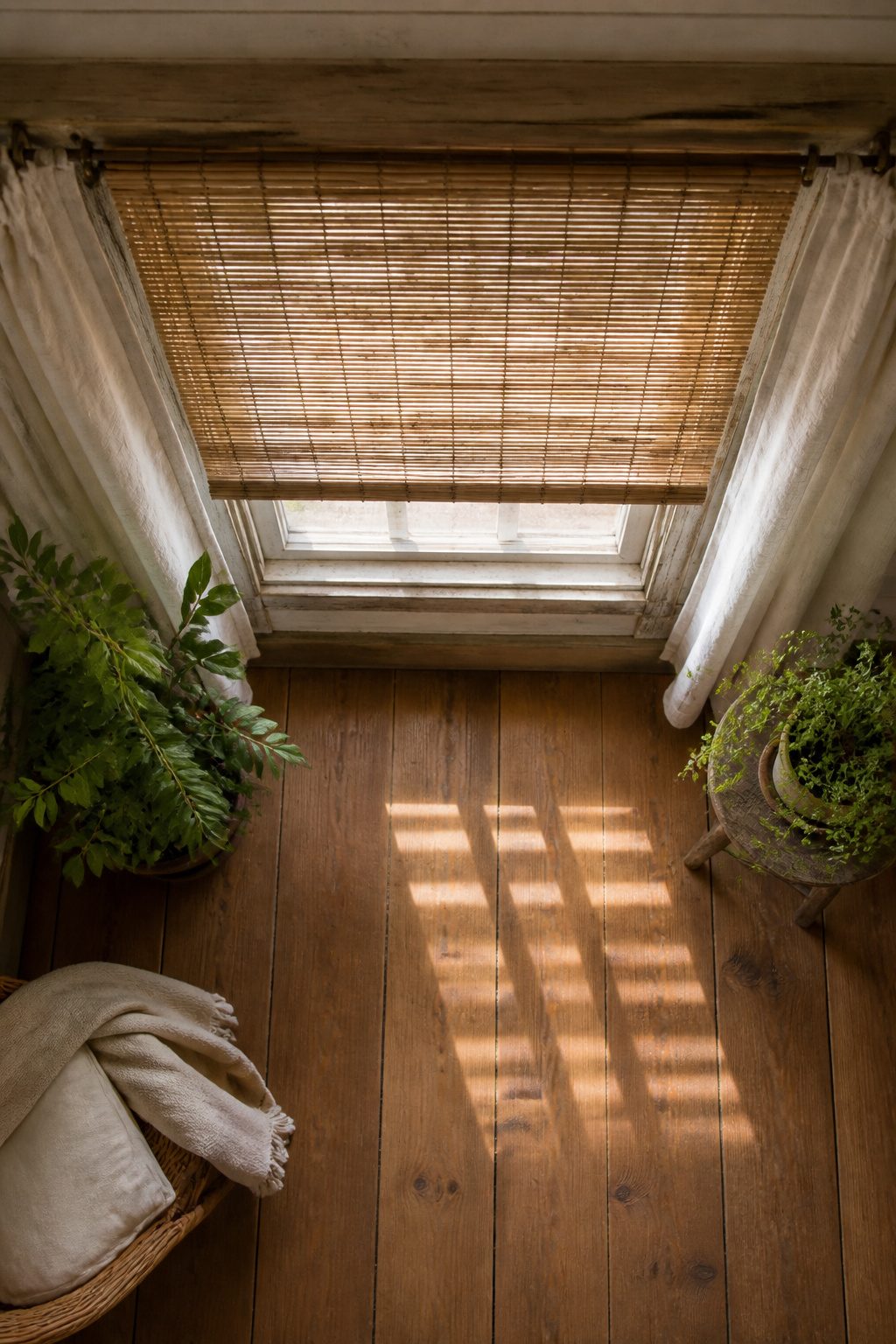 Rustic Window Treatments: 10 Ideas for Style and Function 11 Close-up of bamboo shades and natural materials used in window treatments.