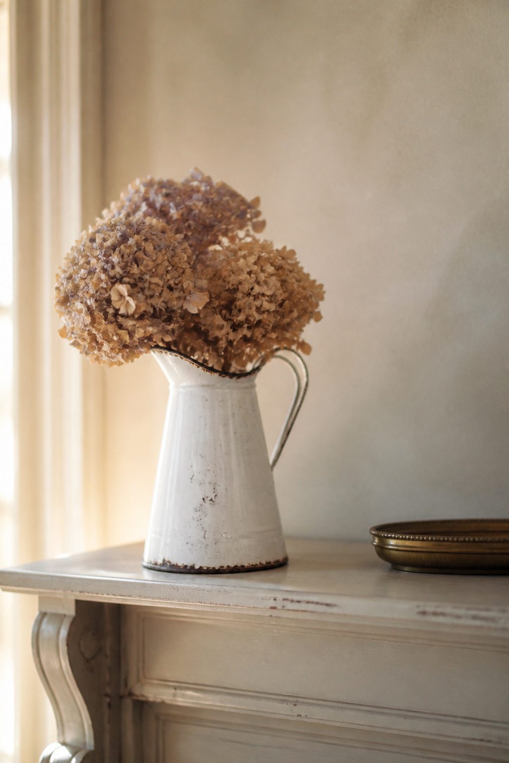 10 Shabby Chic Living Room Ideas for Soft, Lived-In Charm 6 A vintage jelly mould and a burnished frame on display.