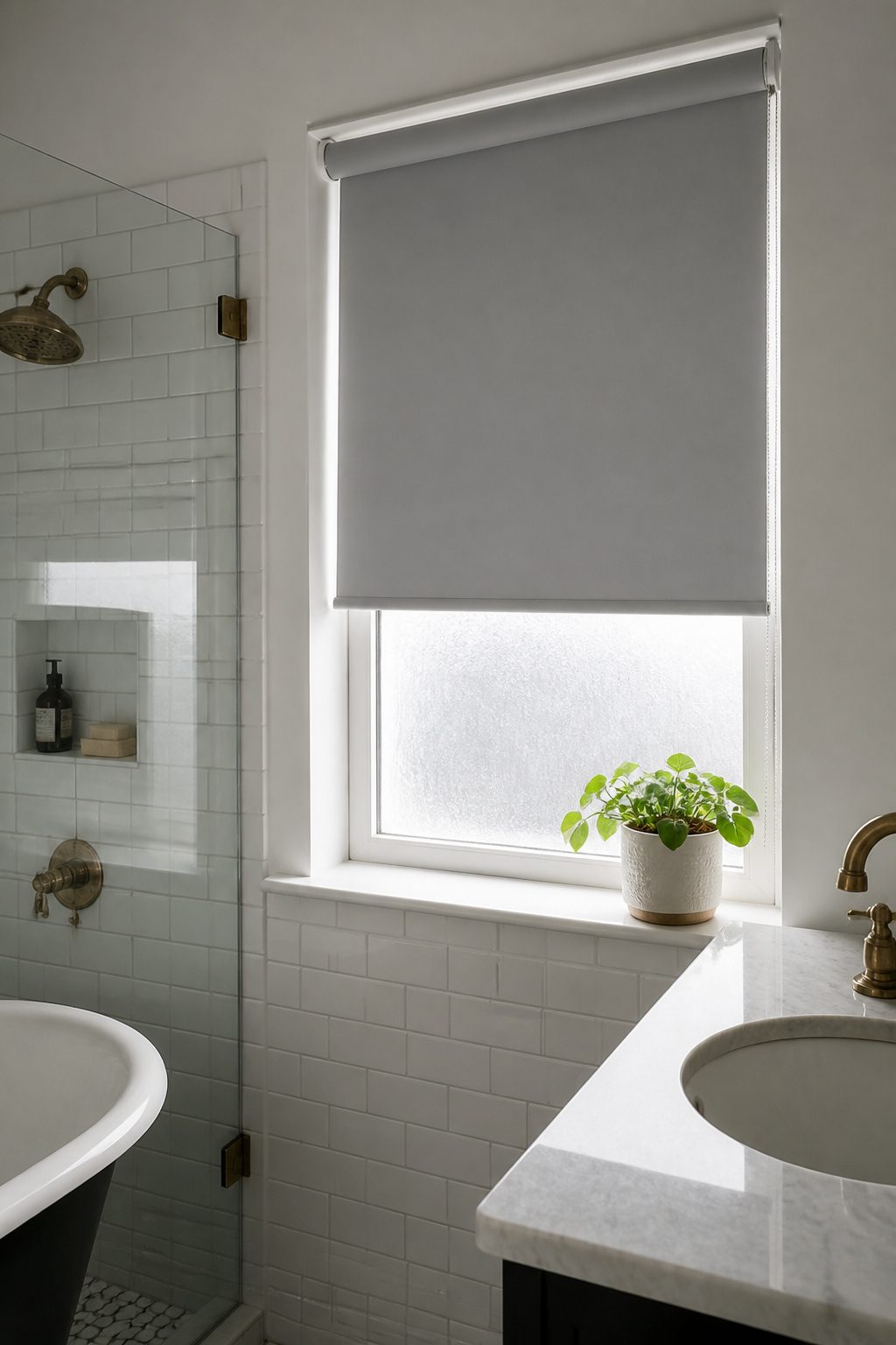 12 Small Window Privacy Ideas: Blinds, Shades, Film & More 2 Light grey PVC roller shades covering a small bathroom window.