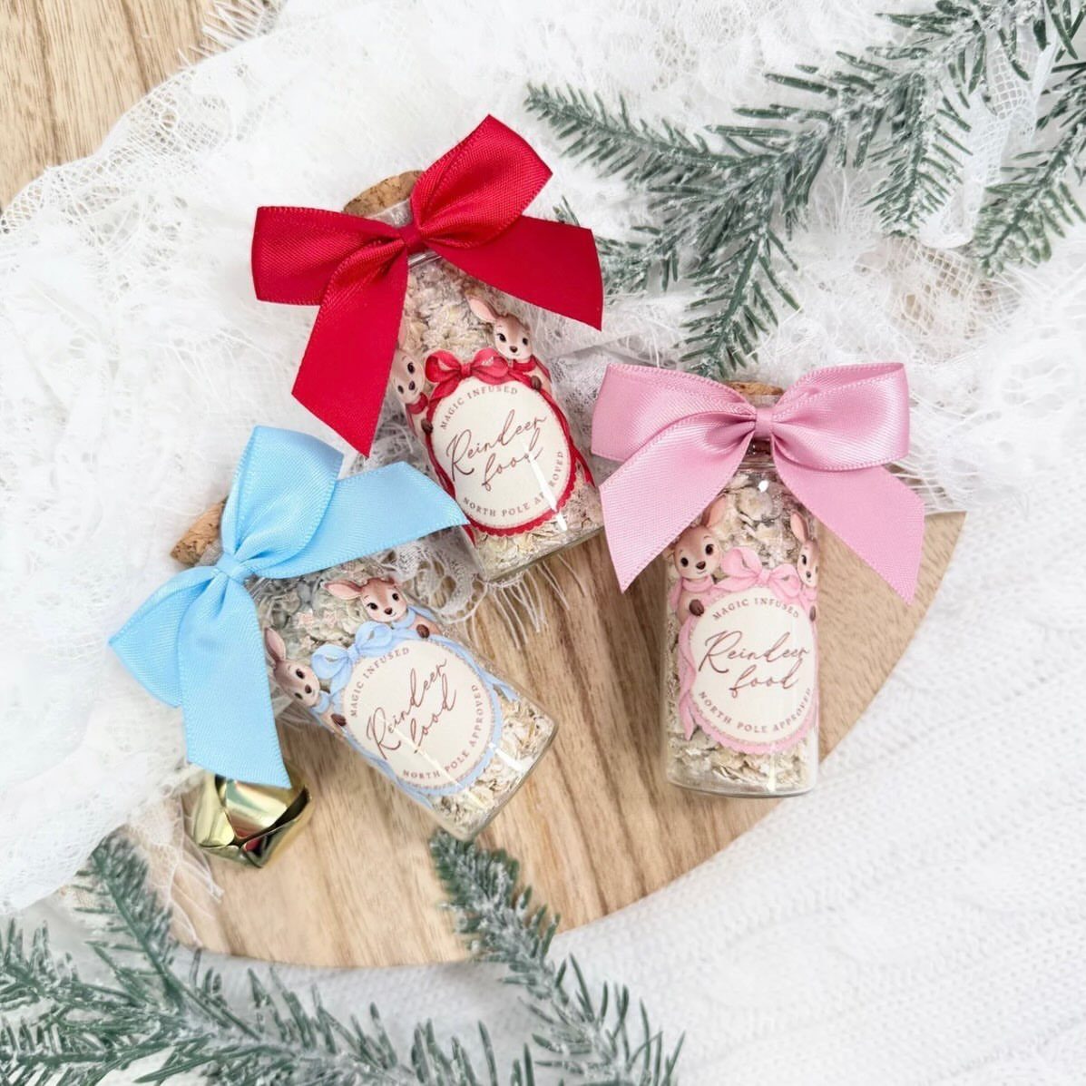 32 Xmas Gifts to Make: Easy Ideas for Handmade Holiday Presents 18 Three small glass jars filled with reindeer food, decorated with colorful ribbons and reindeer labels.